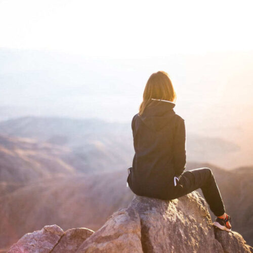 girl-at-top-of-mountain